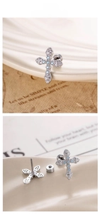 Close-up of cross cartilage studs with blue and white zircon and screw-back closure