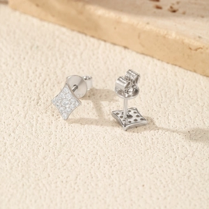 Sparkling S925 sterling silver diamond-encrusted rhombic stud earrings on a stone base