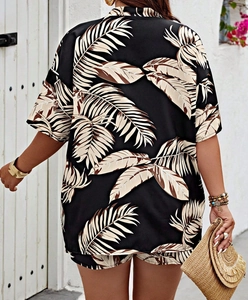 Back view of a summer two-piece set featuring tropical leaf print and relaxed resort fit
