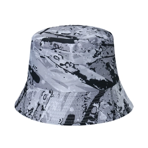 Detail shot of graffiti canvas bucket hat with reinforced stitching and ink splatter pattern