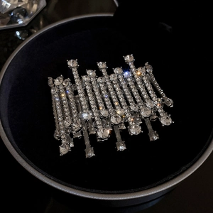 Macro shot of silver-colored layered rhinestone bracelet on premium black velvet background