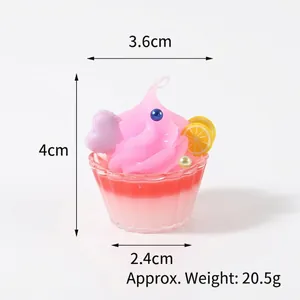 Miniature cupcake charm with pink cream, purple heart, and lemon slice in a striped cup