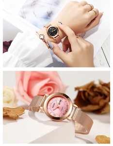 Elegant women's rose gold quartz watch with mesh strap and double calendar dial detail.