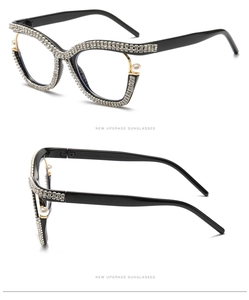 Macro detail of cat-eye frames with pavé rhinestones and pearl hinge accents
