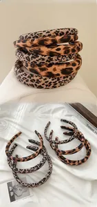 Close-up of leopard print headband set featuring high-quality fabric and handmade inner logo