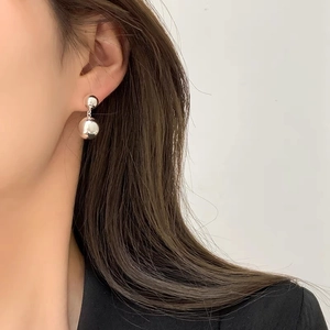 French vintage silver double sphere drop earrings on model for a minimalist chic look