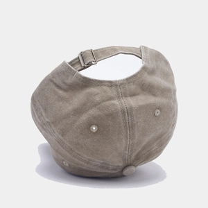 Detailed view of adjustable metal buckle and vintage washed fabric on baseball cap
