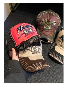 Macro shot of embroidered baseball caps with washed cotton and vintage distressed details