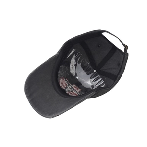 Detail of dark grey washed baseball cap with adjustable metal buckle and leather strap
