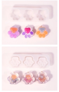 Detailed view of cat paw silicone molds and colorful resin keychain pendants with glitter