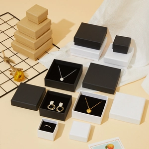 Minimalist cardboard jewelry gift boxes in black, white, and kraft colors with foam inserts