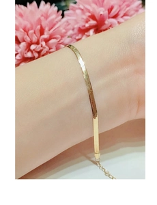 Detailed view of a gold S925 sterling silver snake bone chain bracelet with adjustable clasp