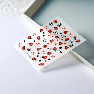 Detailed 5D embossed nail art stickers with red ladybug and polka dot patterns