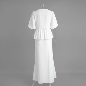 Detail view of cotton two-piece set featuring puff sleeve top and long skirt back