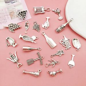 Detailed close-up of silver alloy wine-themed charms including bottles and goblets