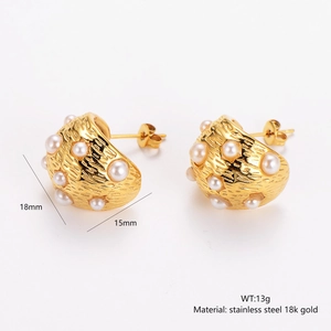 Detailed view of textured 18K gold earrings with white pearls and 18mm size measurements