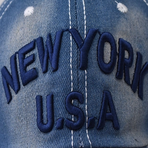 Dark blue washed denim baseball cap with New York USA embroidery and white contrast stitching