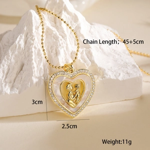 Detail view of heart pendant with mother and child carving and size specifications
