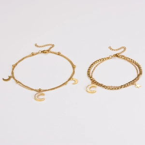 Double-layered gold stainless steel anklet set with star and moon charms on white background