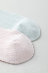 Macro detail of seamless toe stitching and breathable mesh texture on thin summer socks