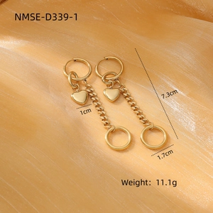 Detail showing dimensions of gold heart and circle drop earrings on champagne silk
