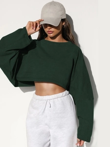 Women's dark green cropped long sleeve sweatshirt with grey drawstring joggers