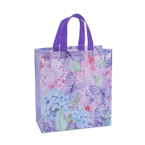 Waterproof non-woven tote bag with purple floral print and durable woven handles