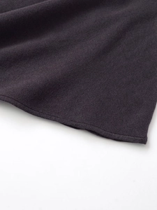 Detail shot of the high-density purple knit fabric texture and premium hem stitching