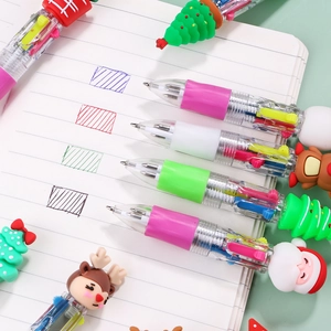 Christmas-themed 6-color ballpoint pens with cartoon Santa and deer toppers on notebook