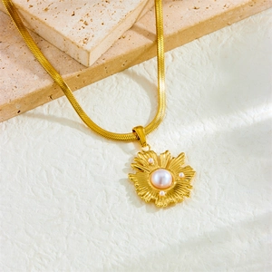Golden sunflower freshwater pearl pendant necklace on a flat gold blade snake chain