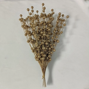 Detail of faux gold glitter berries and branches for Christmas floral decorations
