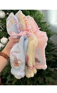 Detailed view of soft coral fleece sleep socks with cute animal embroidery and bows