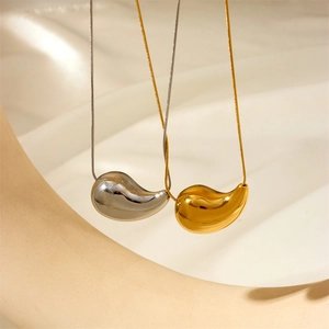 Polished gold and silver teardrop pendant necklaces on sleek snake chains for women