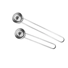 Close-up of dual stainless steel mini whisk spoons with ergonomic spring handles