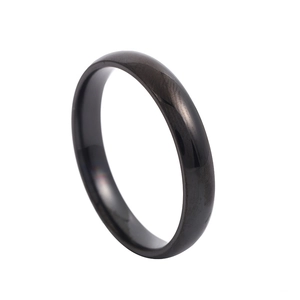 Detail of 2mm black domed stainless steel ring with a polished reflective finish
