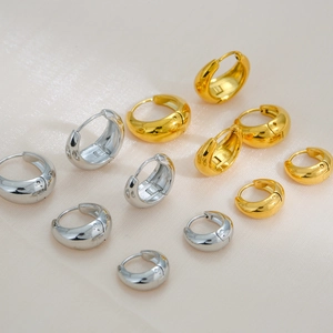 Golden and silver chunky stainless steel hoop earrings in various sizes for women
