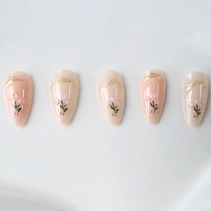 3D floral press-on nails with lavender flower design and gold lines on almond shape