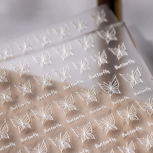 Delicate 5D butterfly embossed nail art stickers with white 3D textured relief design