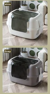 Detail view of large white and gray cat litter boxes with cat ear lids and scooper
