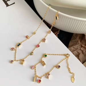 Sparkling multi-color zircon tassel necklace and bracelet set plated in 18K gold