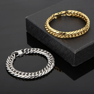 Men's titanium steel cuban link bracelets in gold and silver finishes on black background