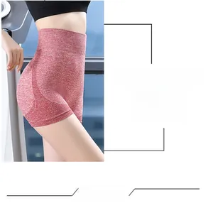 Detail of red heathered yoga shorts showing the non-slip hem and seamless breathable mesh