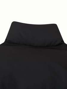 Close-up of the black padded stand-up collar with detailed synthetic fabric texture