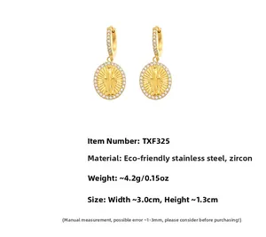 Detail of 18k gold plated stainless steel Mary earrings with shimmering 5A cubic zirconia