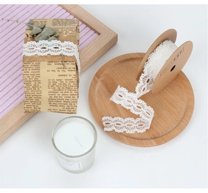White openwork lace ribbon roll for elegant wedding flower and gift wrap decoration