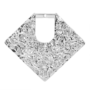 Macro shot of silver diamond-shaped stainless steel pendant with textured crinkle finish