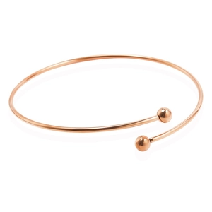 Detailed macro view of rose gold adjustable open cuff bracelet with polished metal beads