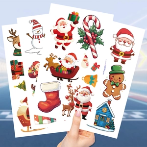 Close-up of waterproof Christmas stickers featuring Santa, reindeer, and snowman designs