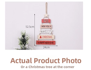 Detail view of tiered wooden Christmas tree ornament with festive lettering and star top