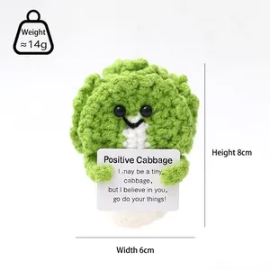 Detail showing an 8cm handmade crochet cabbage toy with an inspirational card